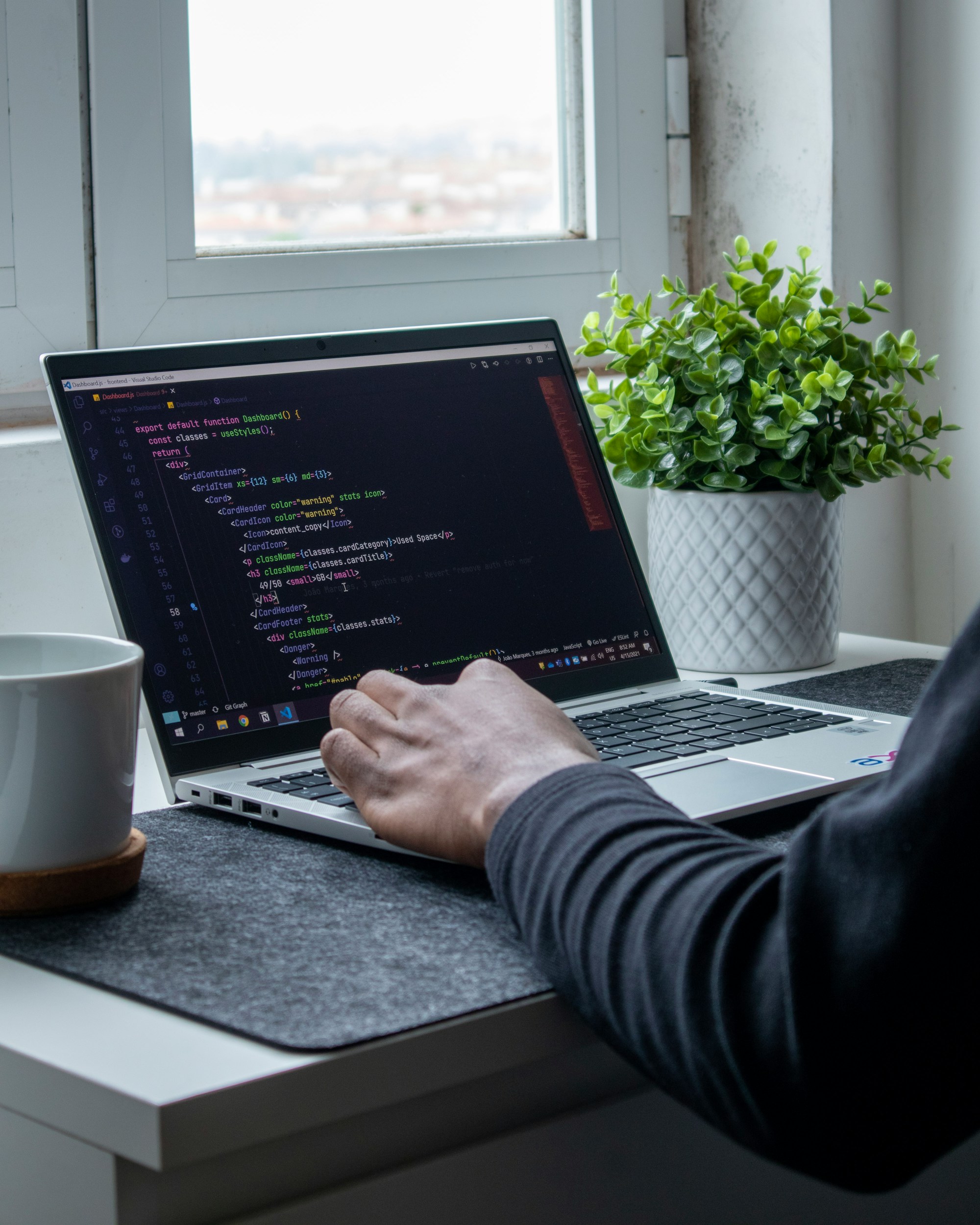 A developer working on a laptop